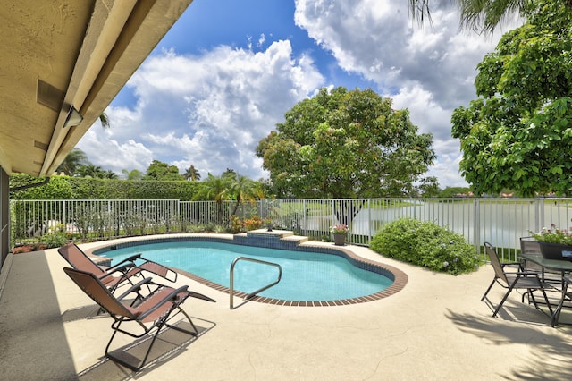 view of swimming pool featuring a patio area