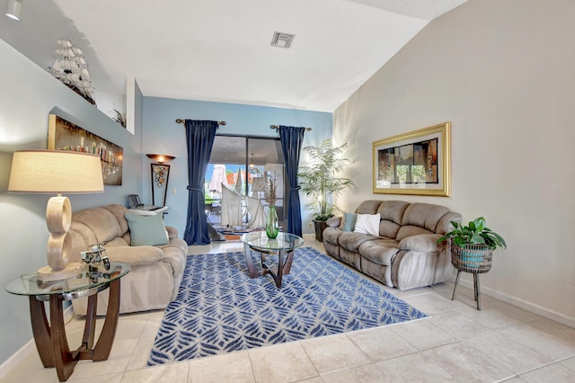 living room featuring tile patterned flooring and vaulted ceiling