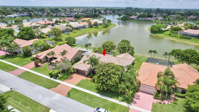 birds eye view of property with a water view