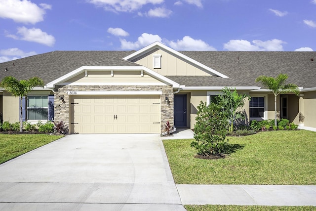 view of front of property featuring a garage and a front yard