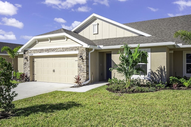 view of front of property with a front yard and a garage