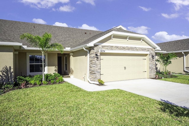 view of front facade featuring a garage and a front lawn