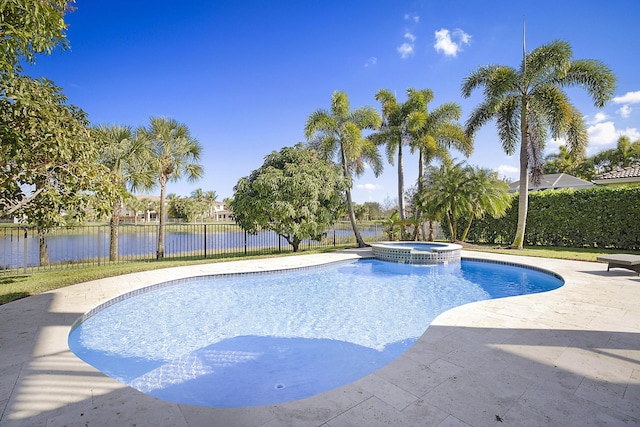 view of pool featuring a patio, a water view, fence, and a pool with connected hot tub