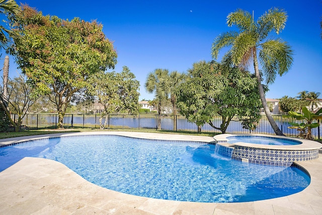 view of pool featuring an in ground hot tub and a water view