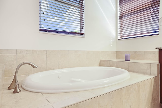 bathroom with tiled tub