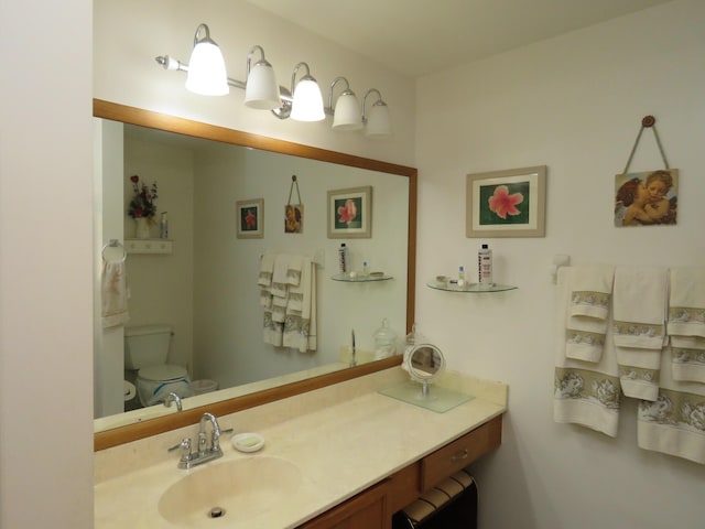 bathroom with vanity and toilet