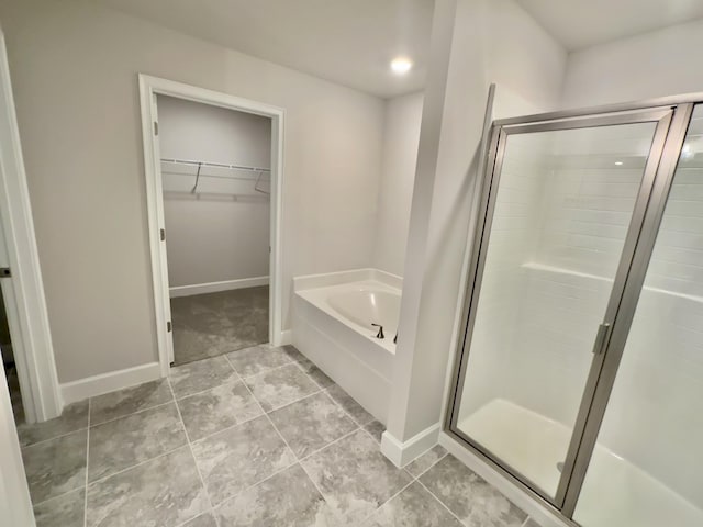 bathroom with vanity, a bath, tile patterned floors, toilet, and a textured ceiling