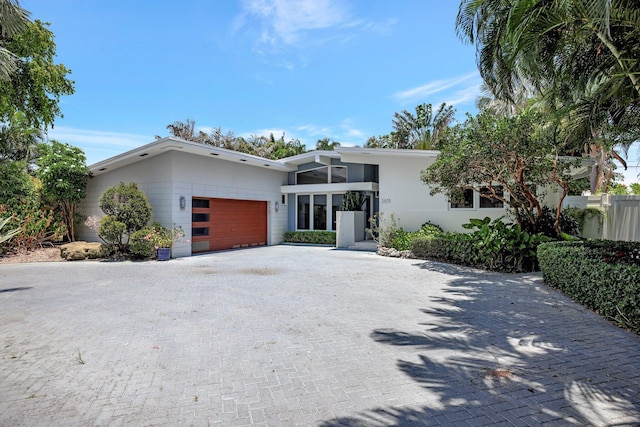 view of front facade with a balcony and a garage