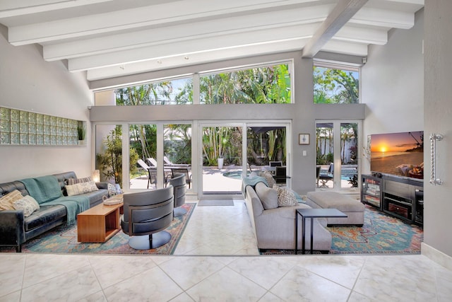 living room with lofted ceiling with beams and french doors