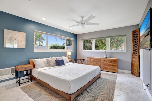 bedroom with multiple windows, light tile patterned floors, and ceiling fan