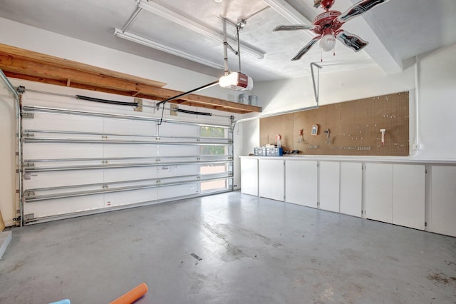 garage featuring ceiling fan and a garage door opener