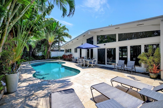 view of swimming pool with a patio area