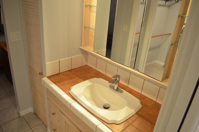 bathroom with tile patterned flooring and vanity