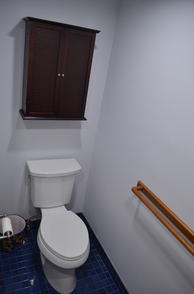 bathroom featuring tile patterned floors and toilet