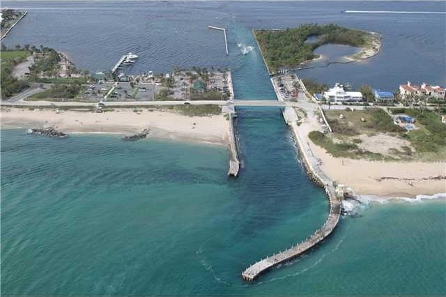 bird's eye view featuring a view of the beach and a water view