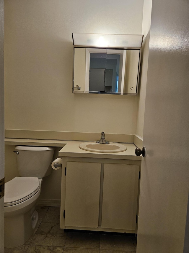 bathroom featuring vanity and toilet