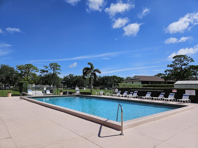 view of swimming pool with a patio area