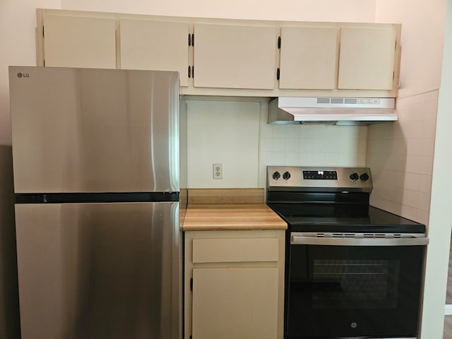 kitchen with tasteful backsplash and stainless steel appliances