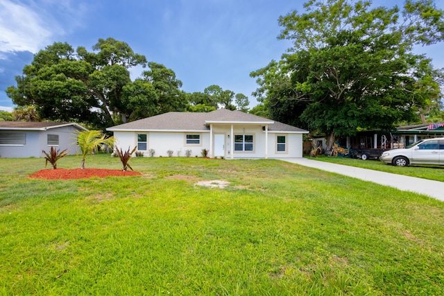 single story home with a front lawn