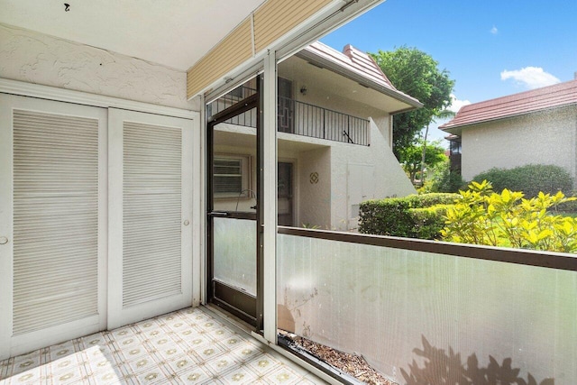 property entrance with a balcony