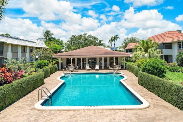 view of swimming pool with a patio area