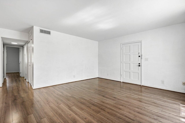 spare room with hardwood / wood-style floors