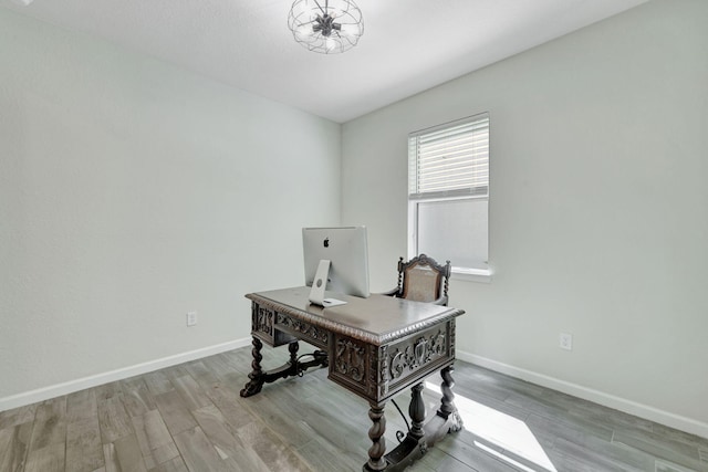 home office with hardwood / wood-style flooring