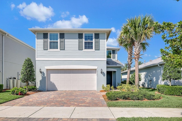 front of property with a garage