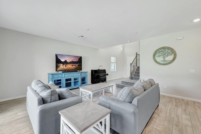 living room with light hardwood / wood-style flooring