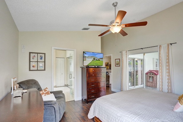 bedroom with visible vents, a ceiling fan, dark wood-style floors, vaulted ceiling, and a textured ceiling