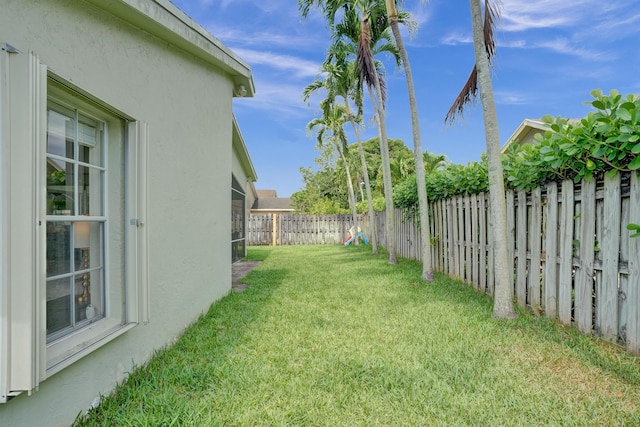 view of yard with a fenced backyard