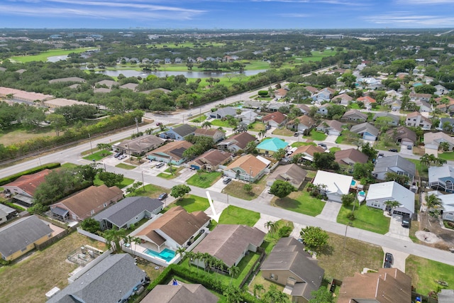 bird's eye view with a water view and a residential view