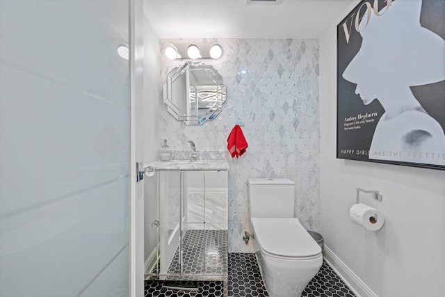 bathroom featuring toilet, tile walls, and tiled shower