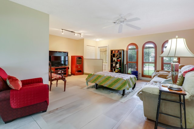 living room featuring ceiling fan and rail lighting