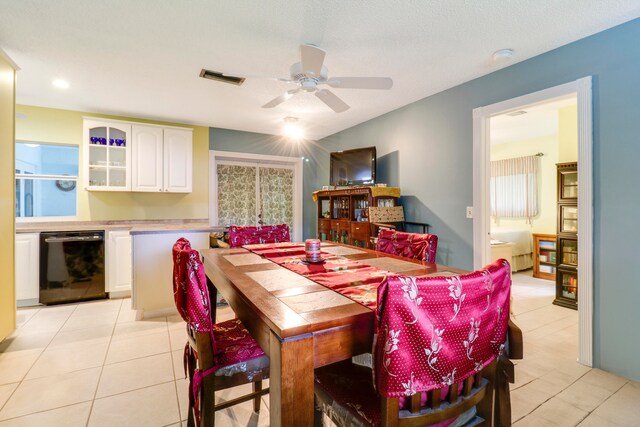 tiled dining space with ceiling fan