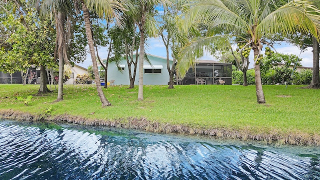 exterior space with a lanai and a yard