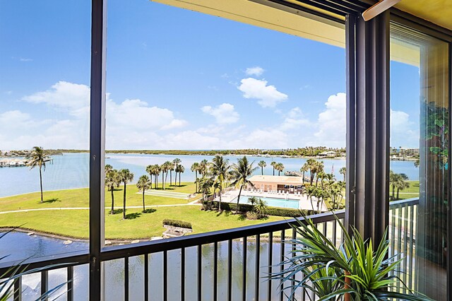 balcony featuring a water view