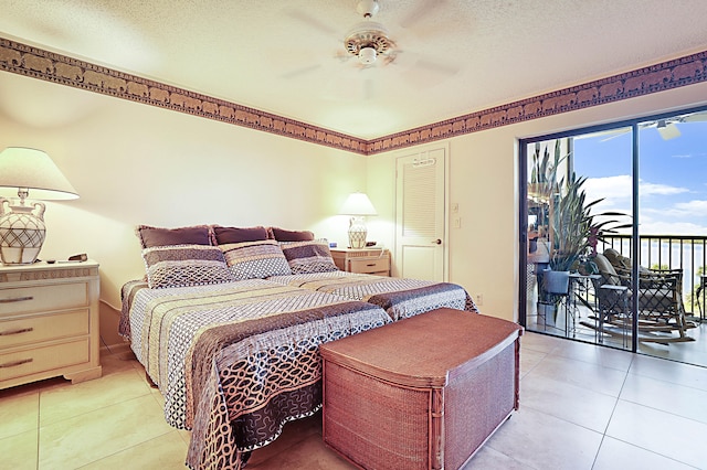 bedroom featuring light tile floors, a textured ceiling, ceiling fan, and access to exterior