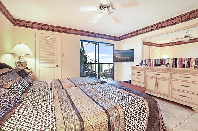 bedroom with light tile flooring, ceiling fan, and access to exterior