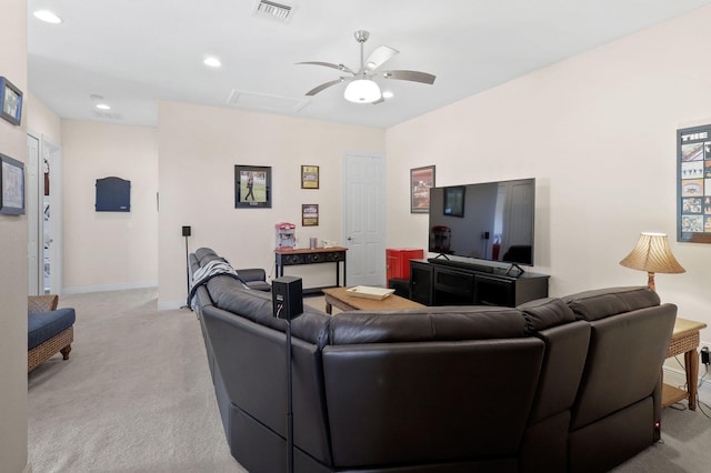 carpeted living room featuring ceiling fan