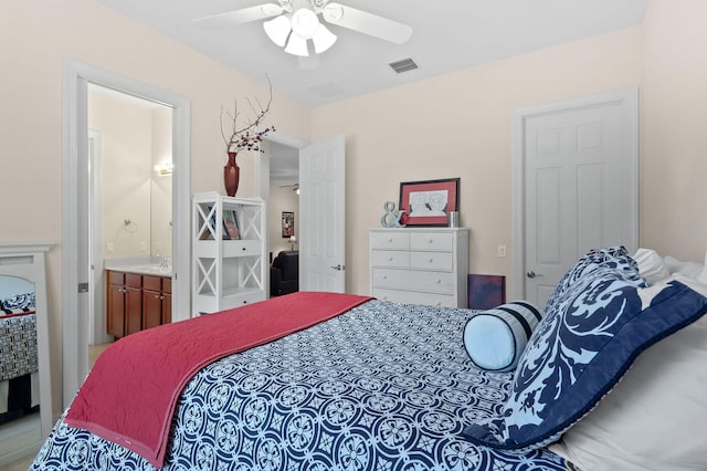 bedroom featuring sink, ensuite bathroom, and ceiling fan