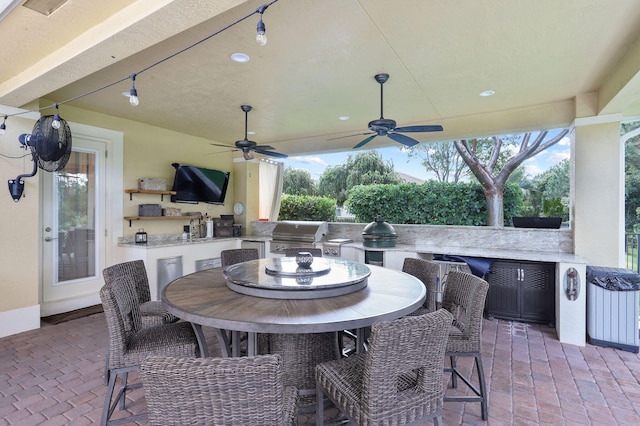 view of patio / terrace with an outdoor kitchen, a grill, and ceiling fan