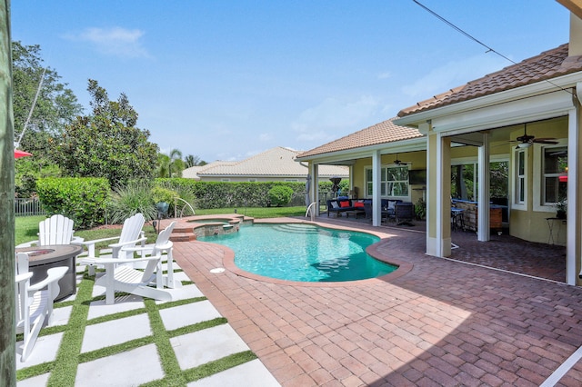 view of swimming pool with a patio, outdoor lounge area, an in ground hot tub, and ceiling fan