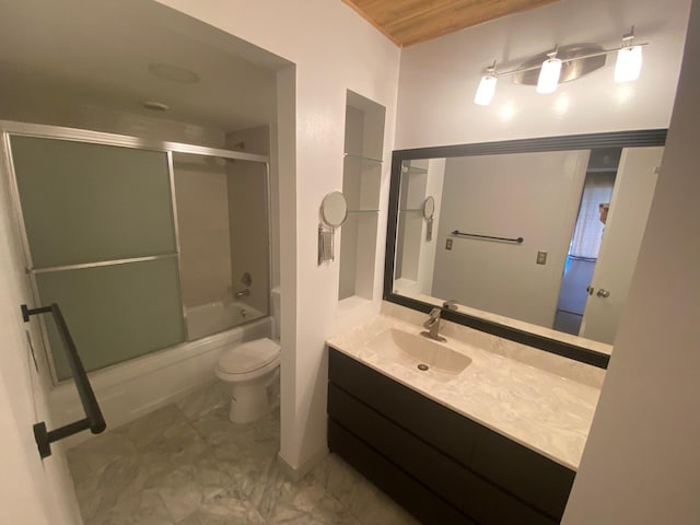 full bathroom with toilet, bath / shower combo with glass door, and vanity