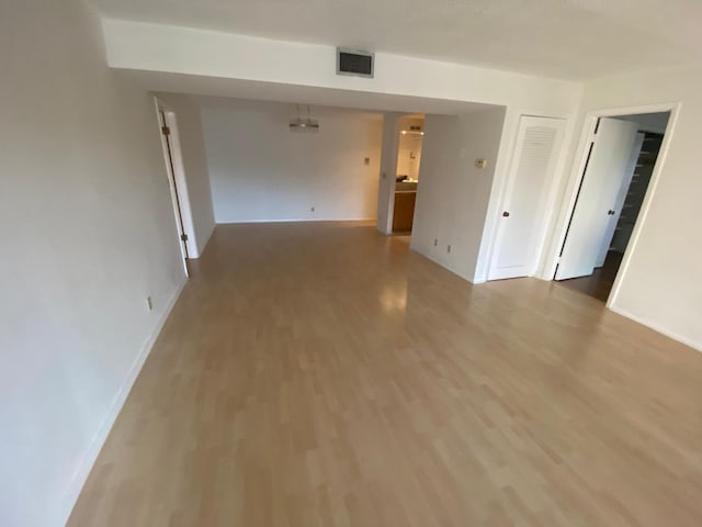 empty room with hardwood / wood-style floors