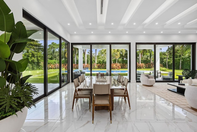 sunroom with beamed ceiling