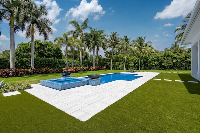 view of pool with an in ground hot tub, a patio, and a lawn