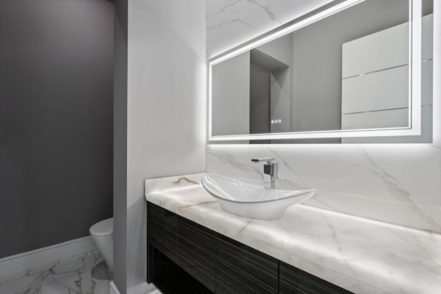 bathroom with vanity and toilet