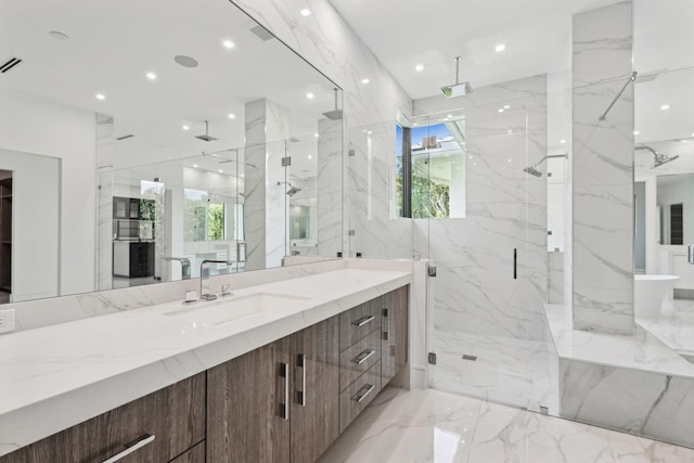 bathroom with vanity and a shower with door