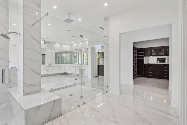 interior space featuring vanity and an enclosed shower